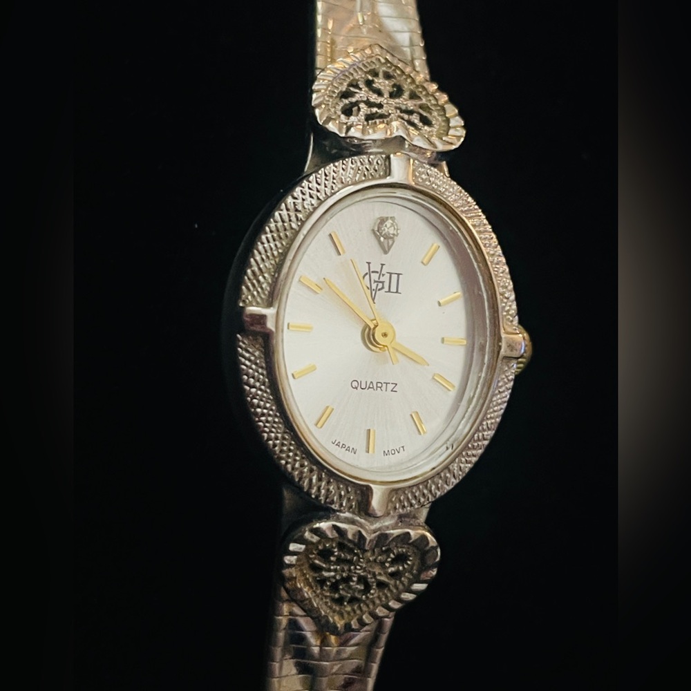 Gorgeous GV 11 vintage wristwatch with beautiful silver-tone filigree design.